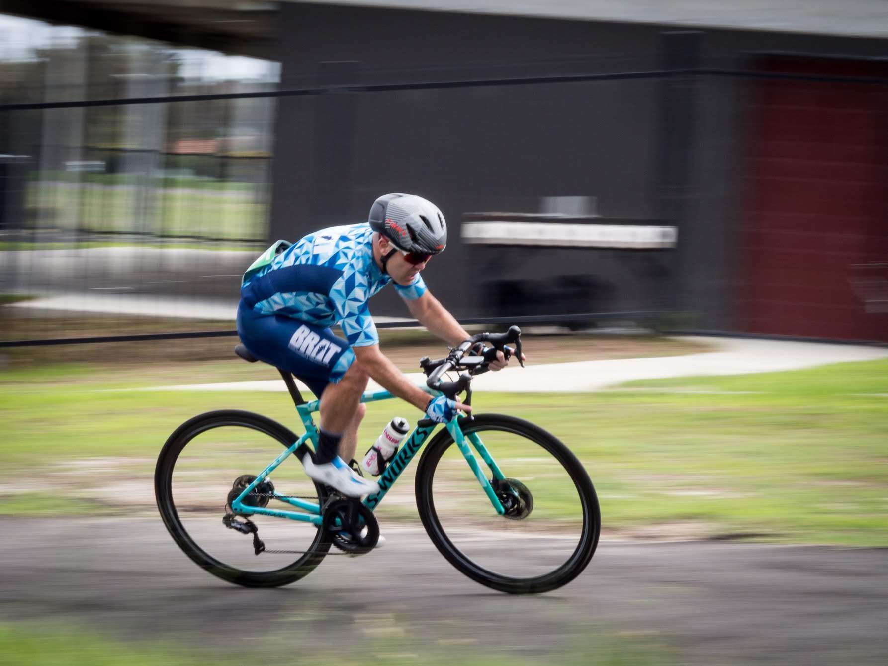 Victor Hong cycling in BRAT club kit